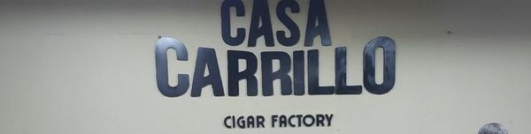 Workers sorting premium tobacco leaves at Casa Carrillo Cigar Factory in Santiago, Dominican Republic.